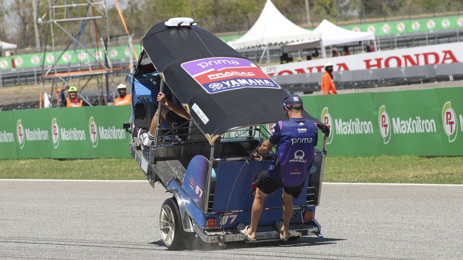 Toprak Razgatlioglu and Jack Miller racing a Tuk Tuk. Photo credit - Gold and Goose