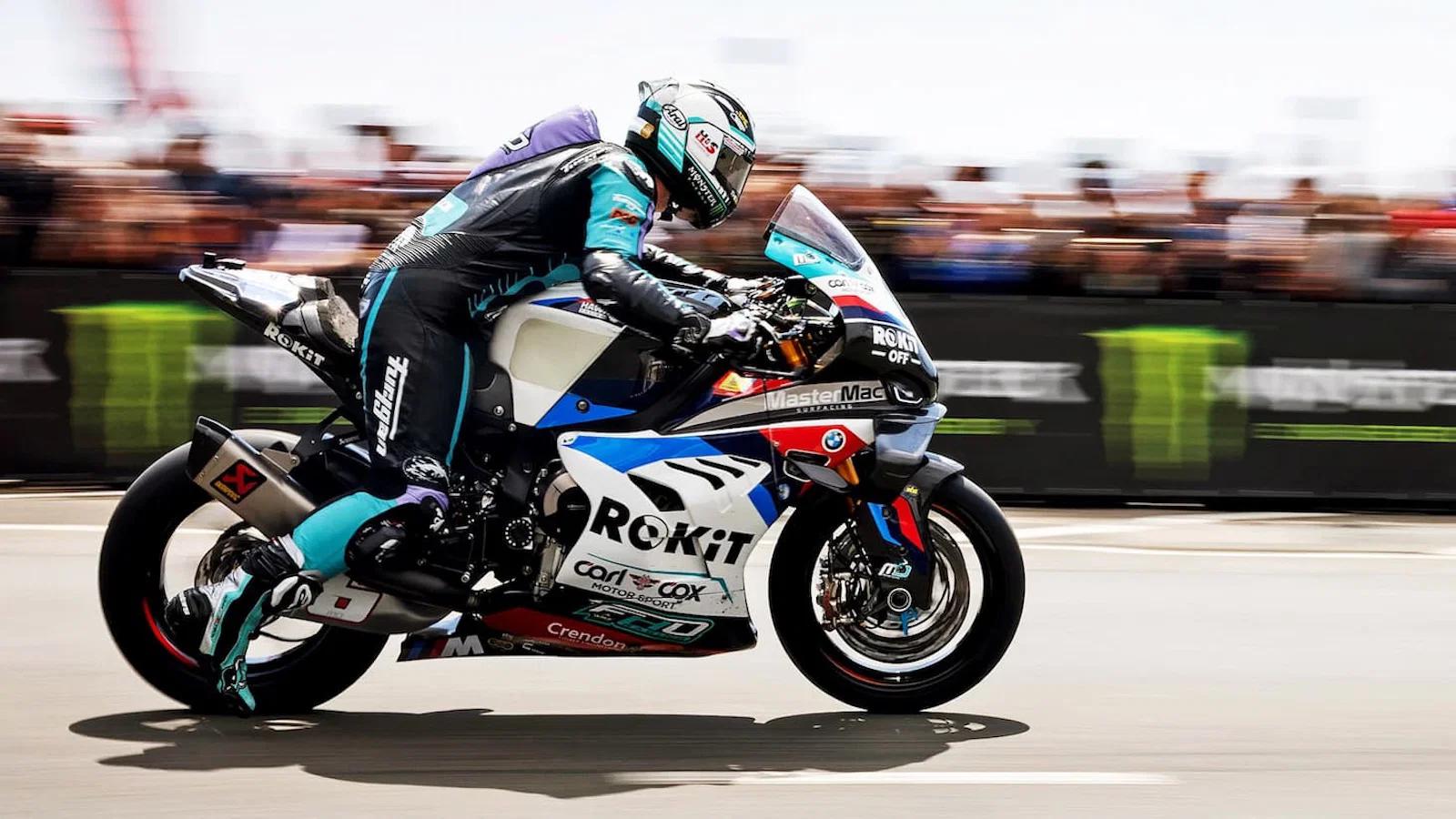 A racer leaves the start line at the TT races