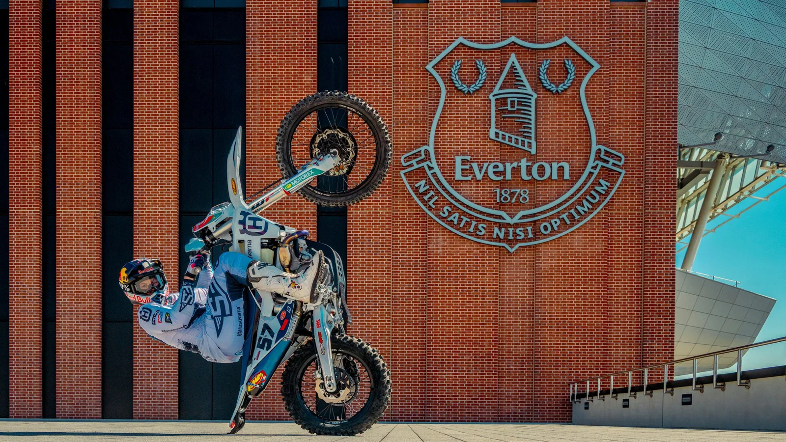 Billy Bolt performing a wheelie outside the new Everton stadium