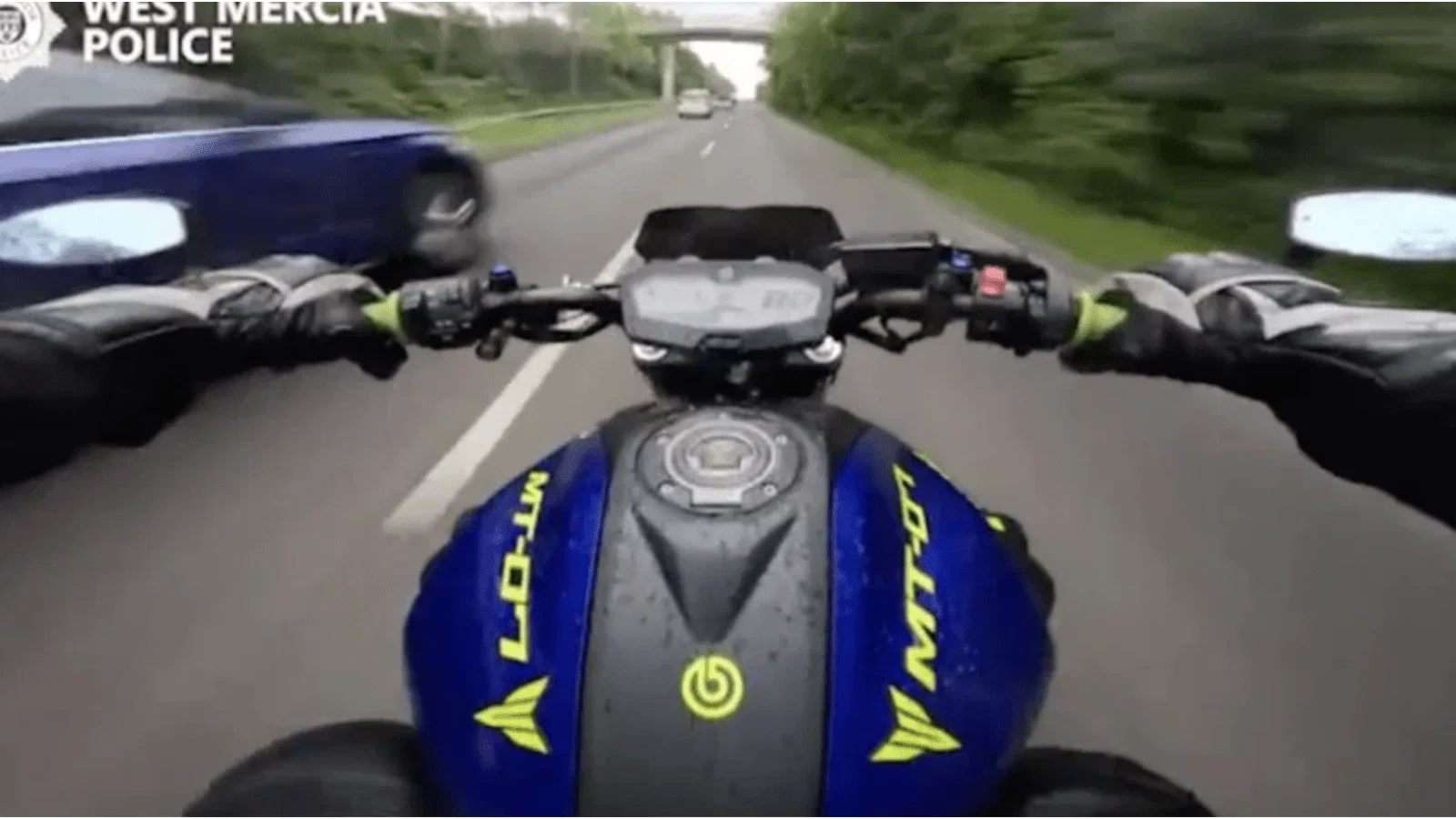 Motorcyclist speeding in the UK.