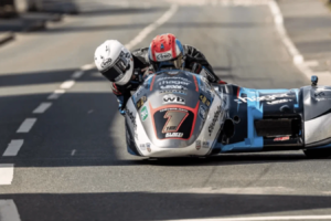 14 fois vainqueur du Sidecar TT de l'île de Man, il fera ses débuts en solo au Classic TT