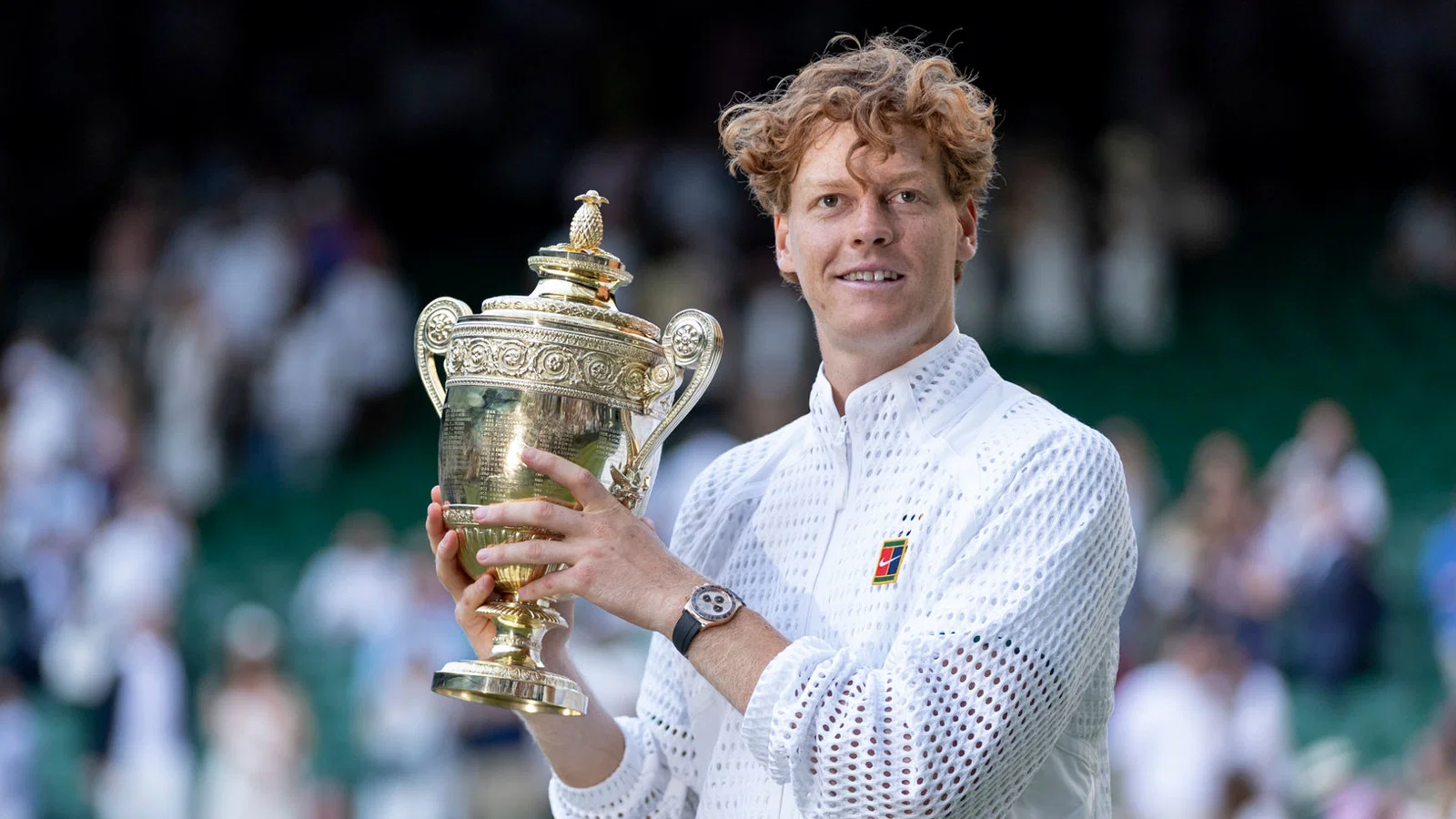 Jannik Sinner holding Wimbledon gentlemen