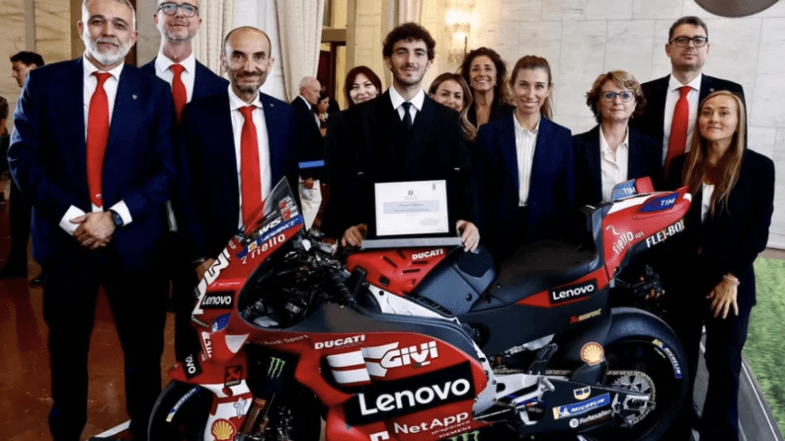 Francesco Bagnaia alongside Ducati CEO Claudio Domenicali.